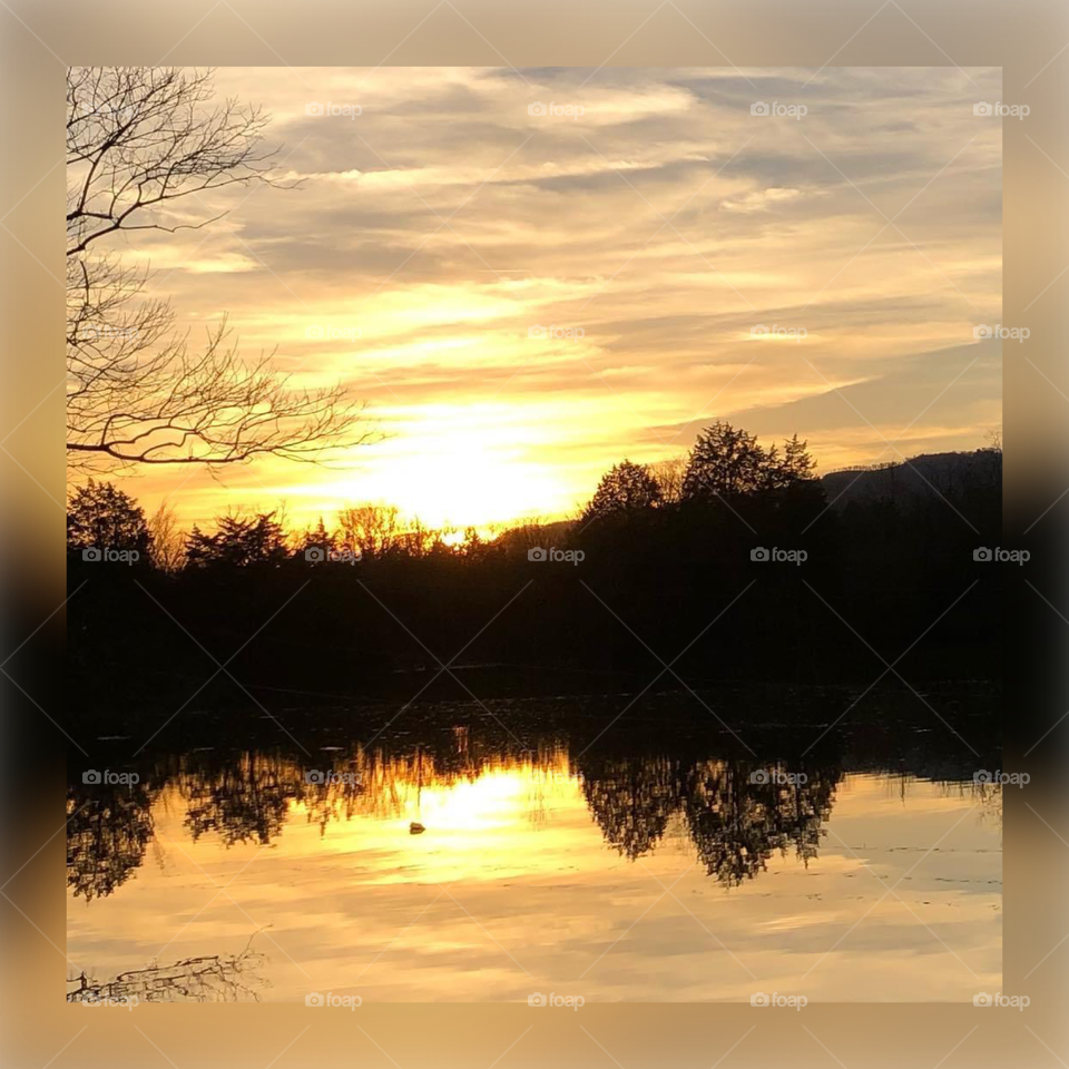 Sunset in the mountains on the lake 