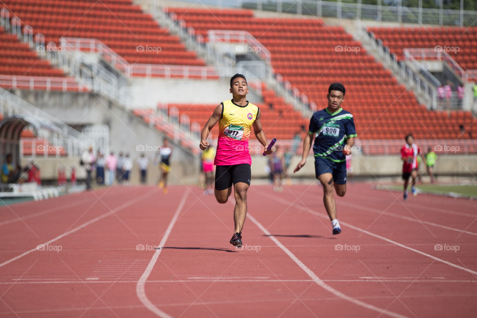 Athletic athlete in the track for the race