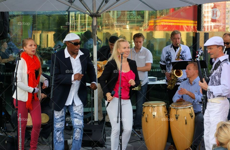 A group playing salsa music on a terrace at the annual Night of the Arts festival in the center of Helsinki, Finland in August.