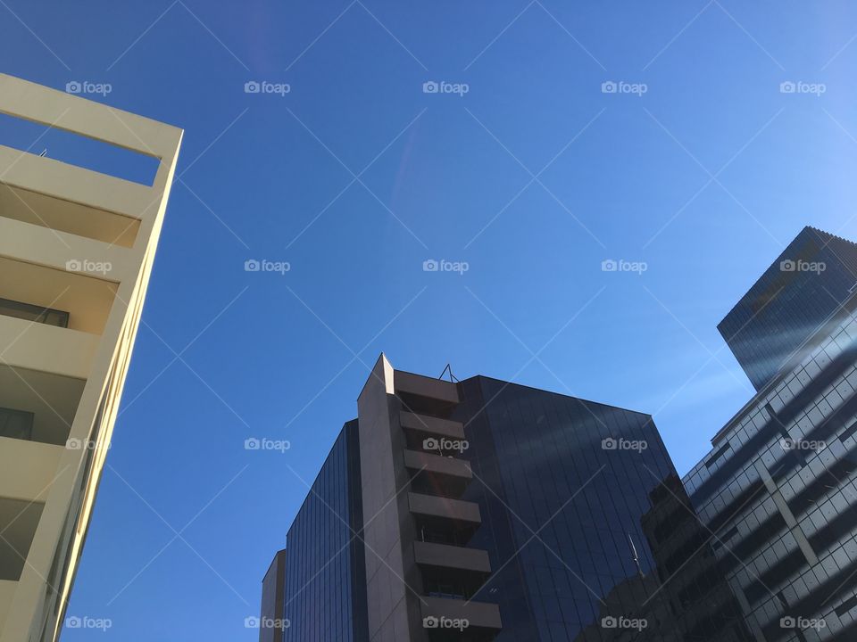 Street view with beautiful sunlight. Ordinary building looks interesting as I was looking up at the sky.