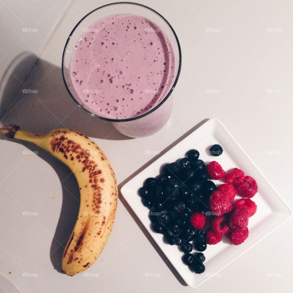 Power Breakfast . Fruits and shake on top of the kitchen counter 
