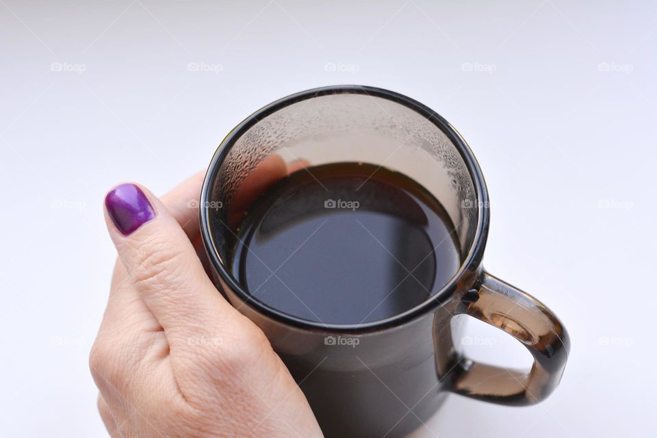 cup of coffee and female hand morning time