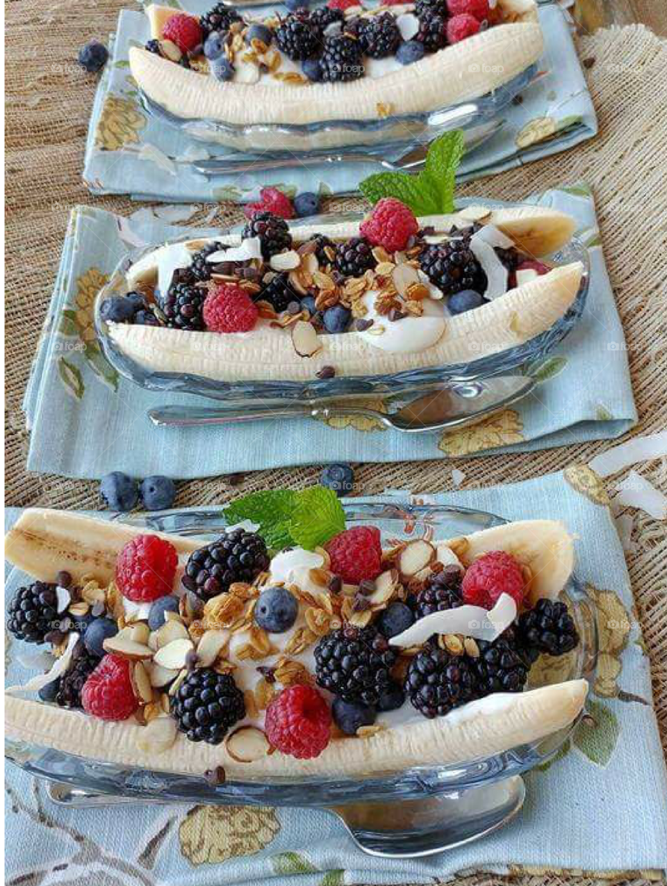 A raspberry and blackberry banana boat.