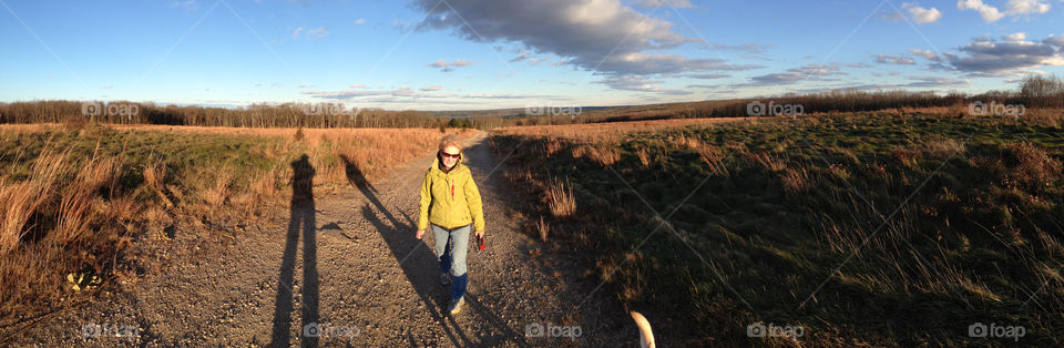 field mountain clouds panorama by bobmanley