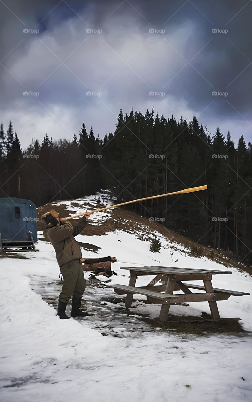 Trembita. A man is playing trembita now in the Carpathian mountains