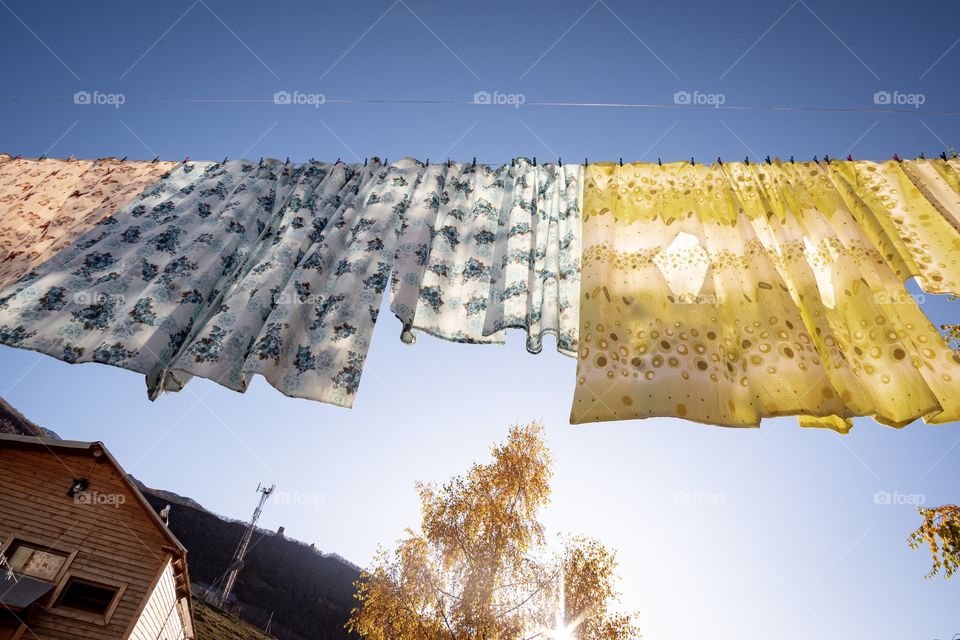 Sunlight pass through Beautiful clothes of local people in lovely village Ushguli in Georgia 