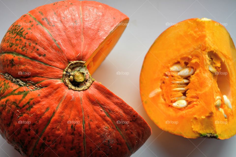 orange pumpkin vegetables sliced texture on a white background