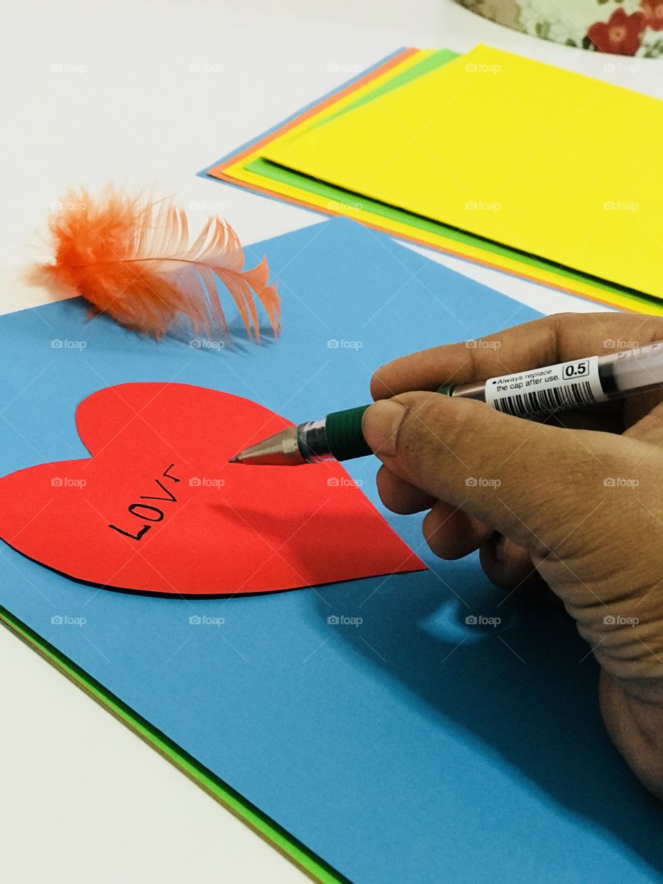 Writing love letter, a pleasant weather with pen and colour paper more over feather