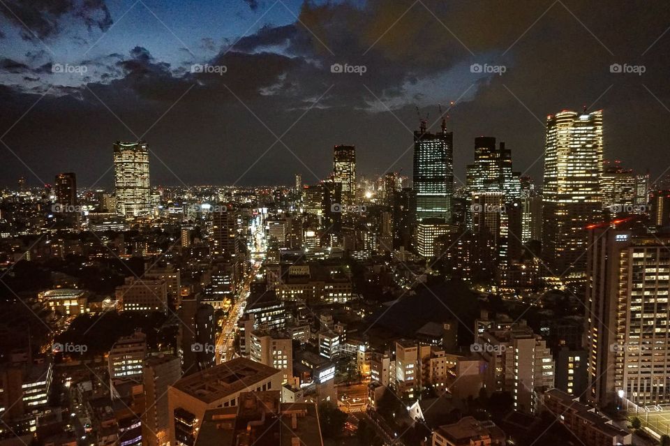 An evening view of the Tokyo skyline as seen from the top of Tokyo Tower in Tokyo, Japan.