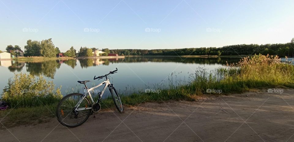 bike 🚲 on a rural road beautiful nature landscape lake shore