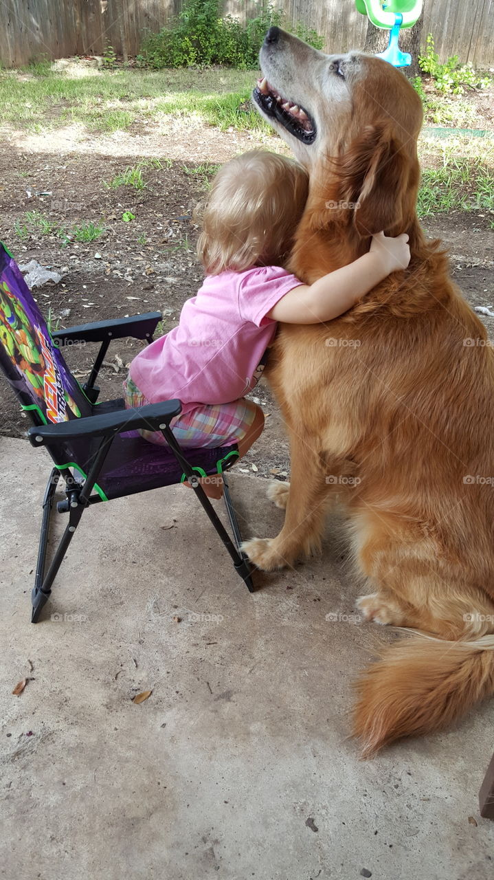 a girl and her dog. she loves her dog