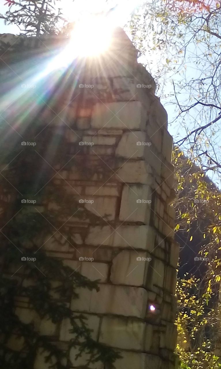 Sunrays over a ruins of marble column in Marble Quarry Park in  Marble, CO 