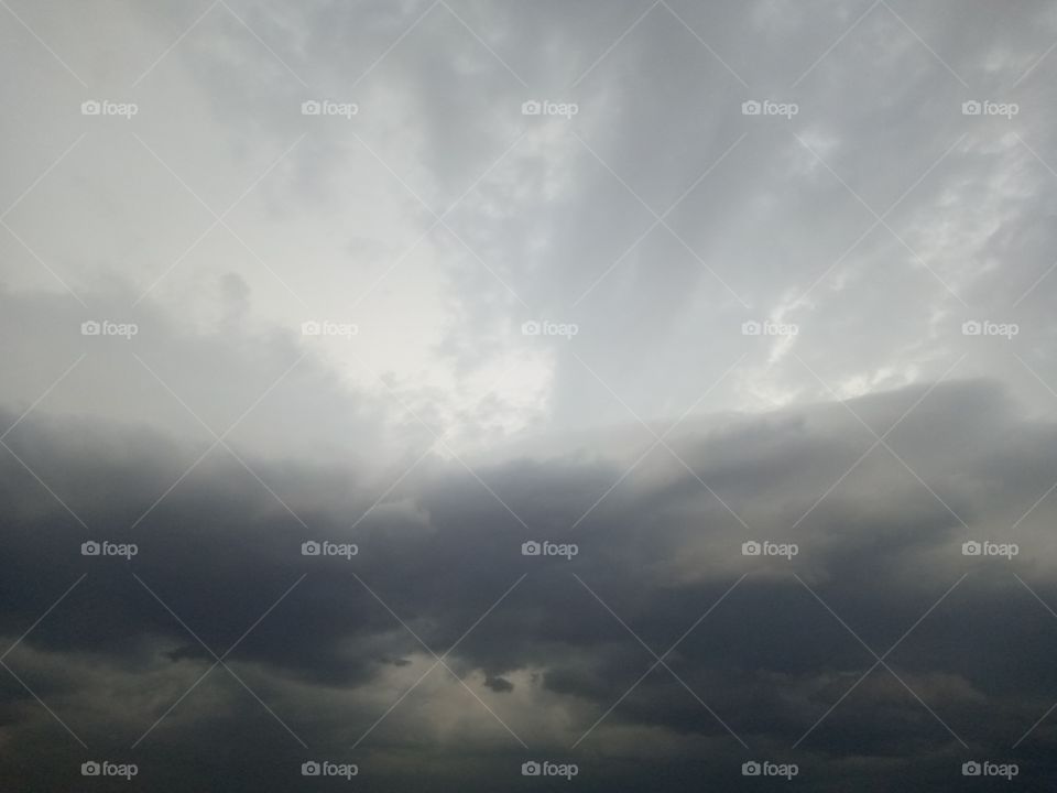 Rain about to fall, the cloud is dark and my heart is gladden because God is about to bless the land.