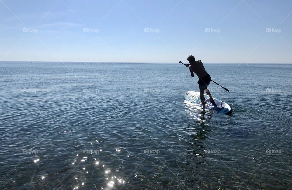 Trying the paddle board