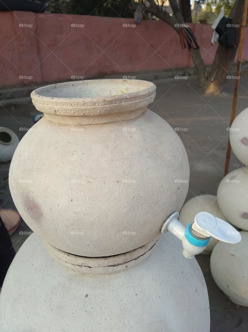 Desi friz, pitcher with tap white in colour looks very beautiful generally found everywhere in the village,cold water