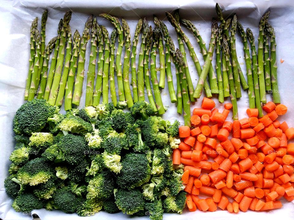 Asparagus Broccoli & Carrots drizzled with Olive Oil salt & pepper waiting to be roasted  a super way to stay fit & eat healthy