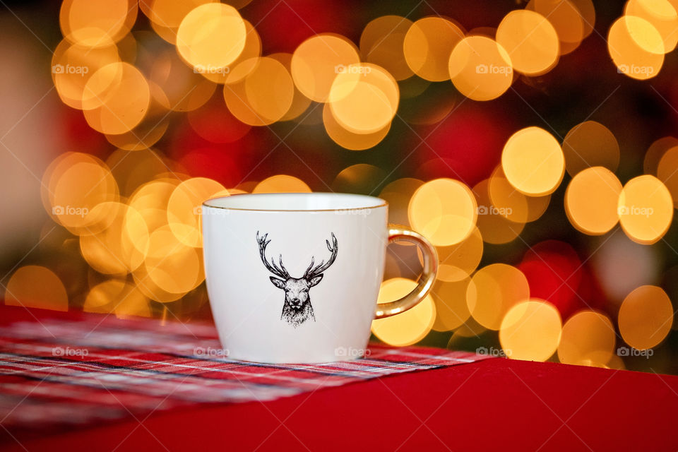 cup of coffee in a cozy festive Christmas atmosphere