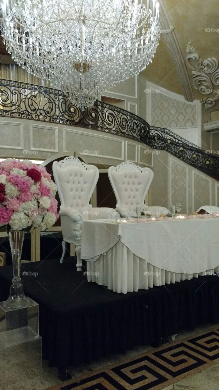 Two White Seats for Bride and Groom at Wedding.