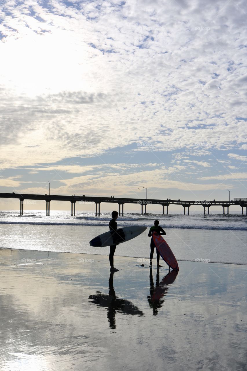 Young surfers at beach waiting for a wave