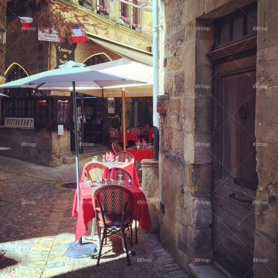 Sun catches a French bistro ready for customers. 