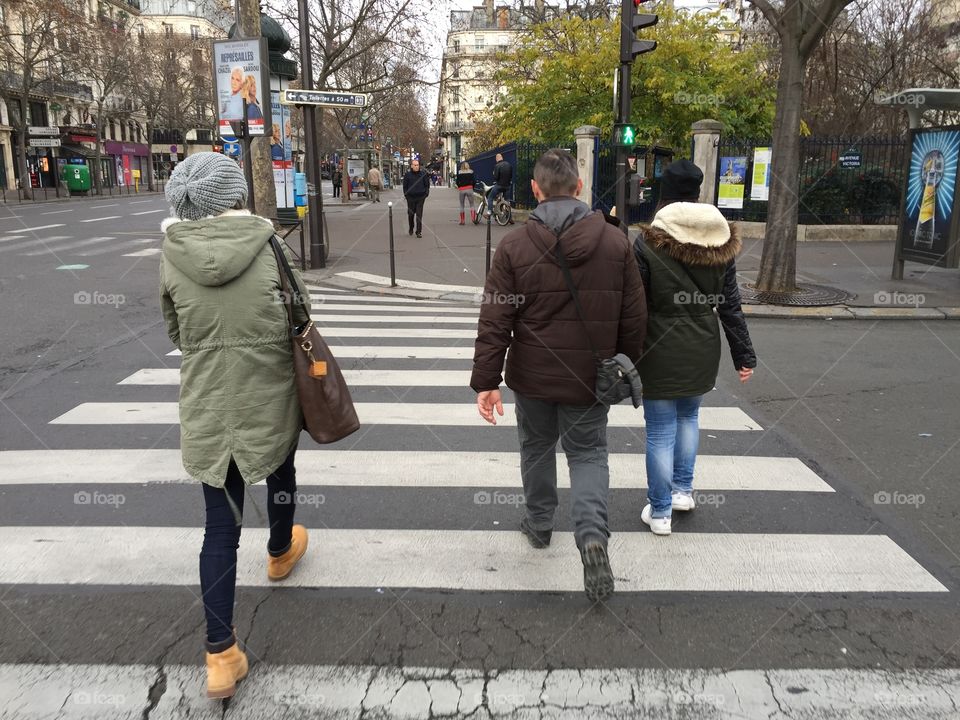 Pedestrians crossing the road on the pedestrian crossing