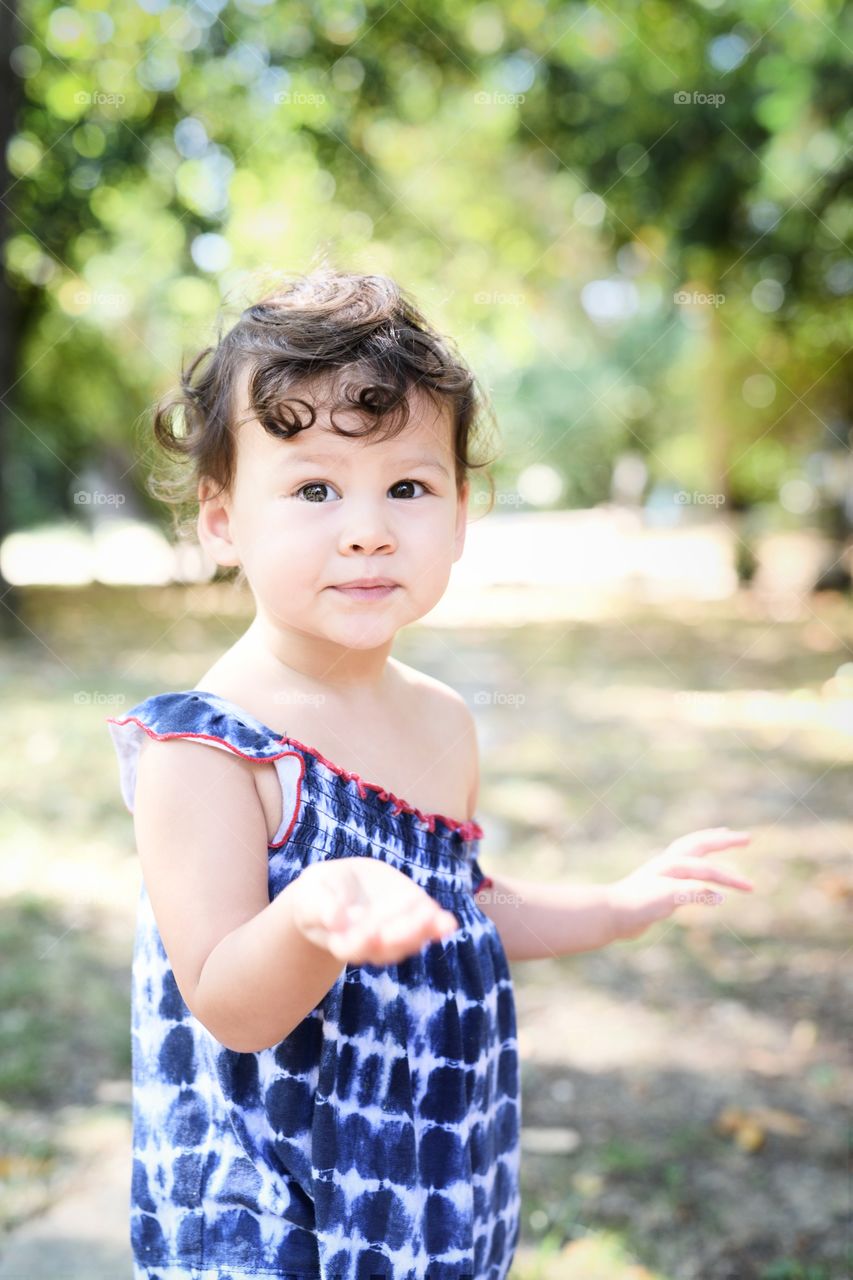 Baby girl blowing a kiss