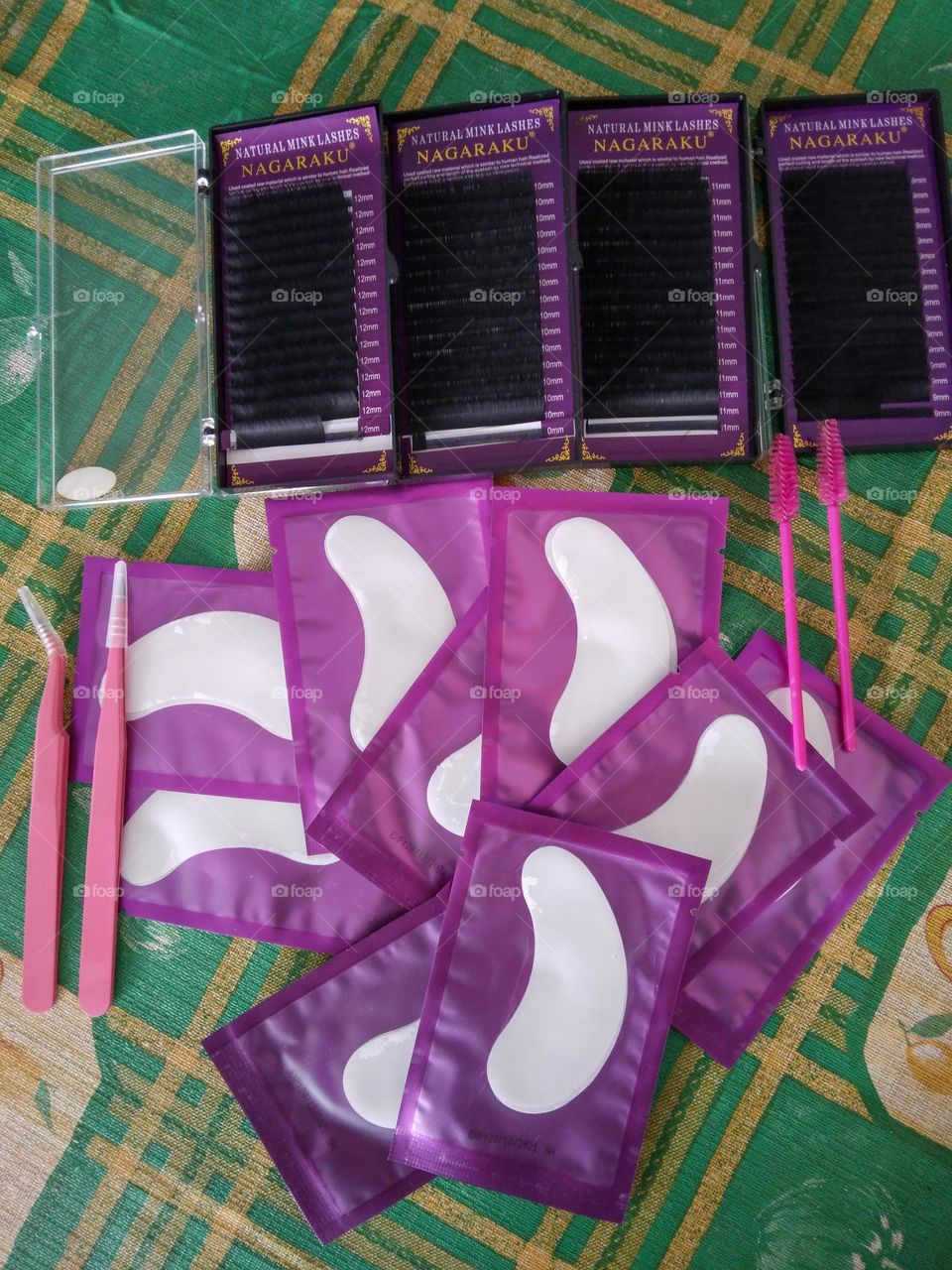 lashes, under eye pads, mascara brush and tweezers