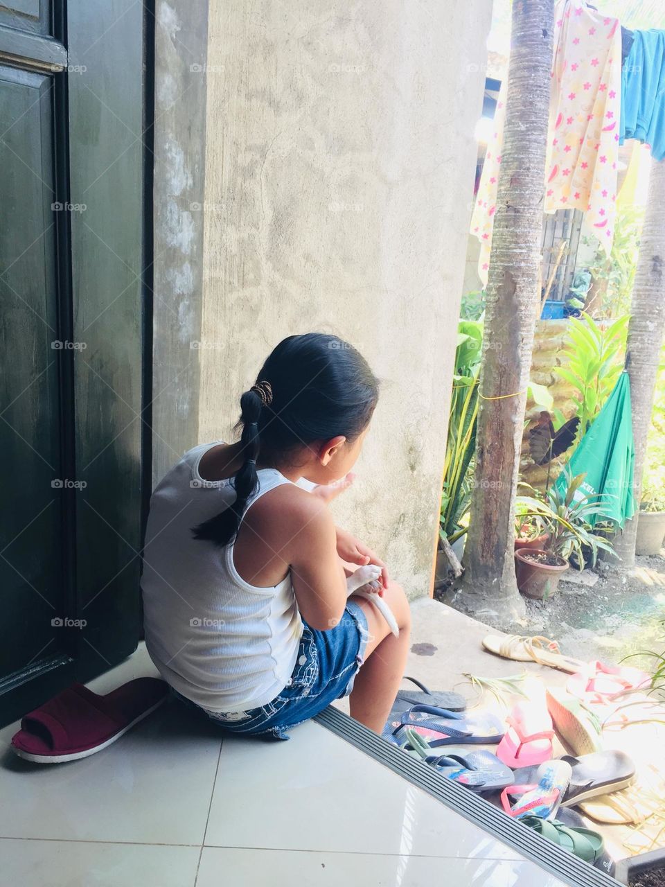 This little one with her puppy, I don’t she’s thinking but I just love takibg her a photo