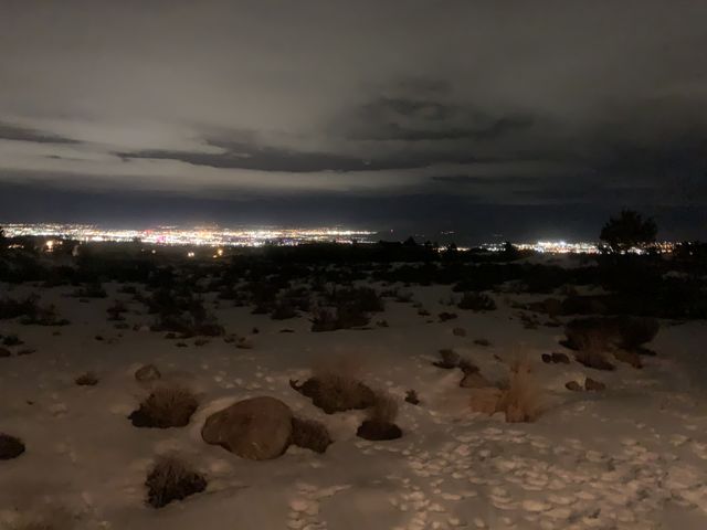 Reno city lights in the distance on a snowy night. 