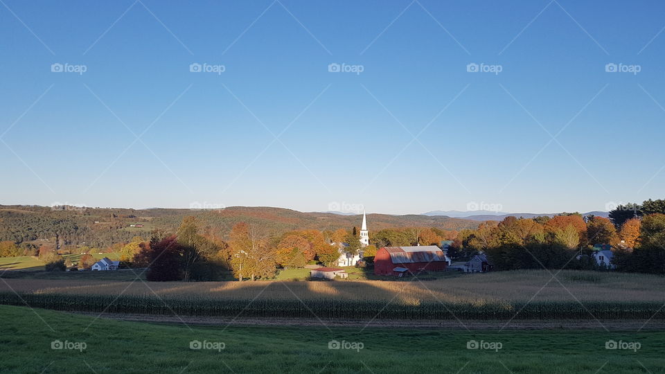 Sunset on a village in Vermont, USA during the fall.