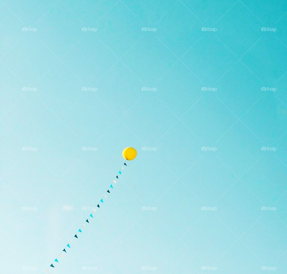 Balloon flying in the sky.