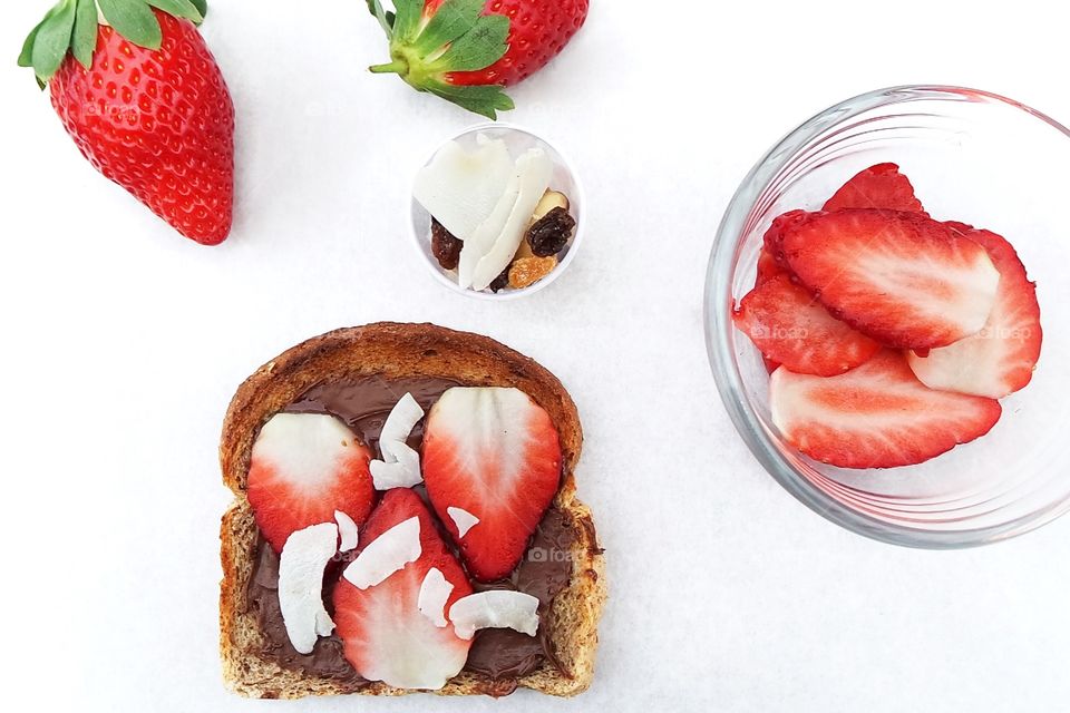 Bread with chocolate spread and strawberry topping 