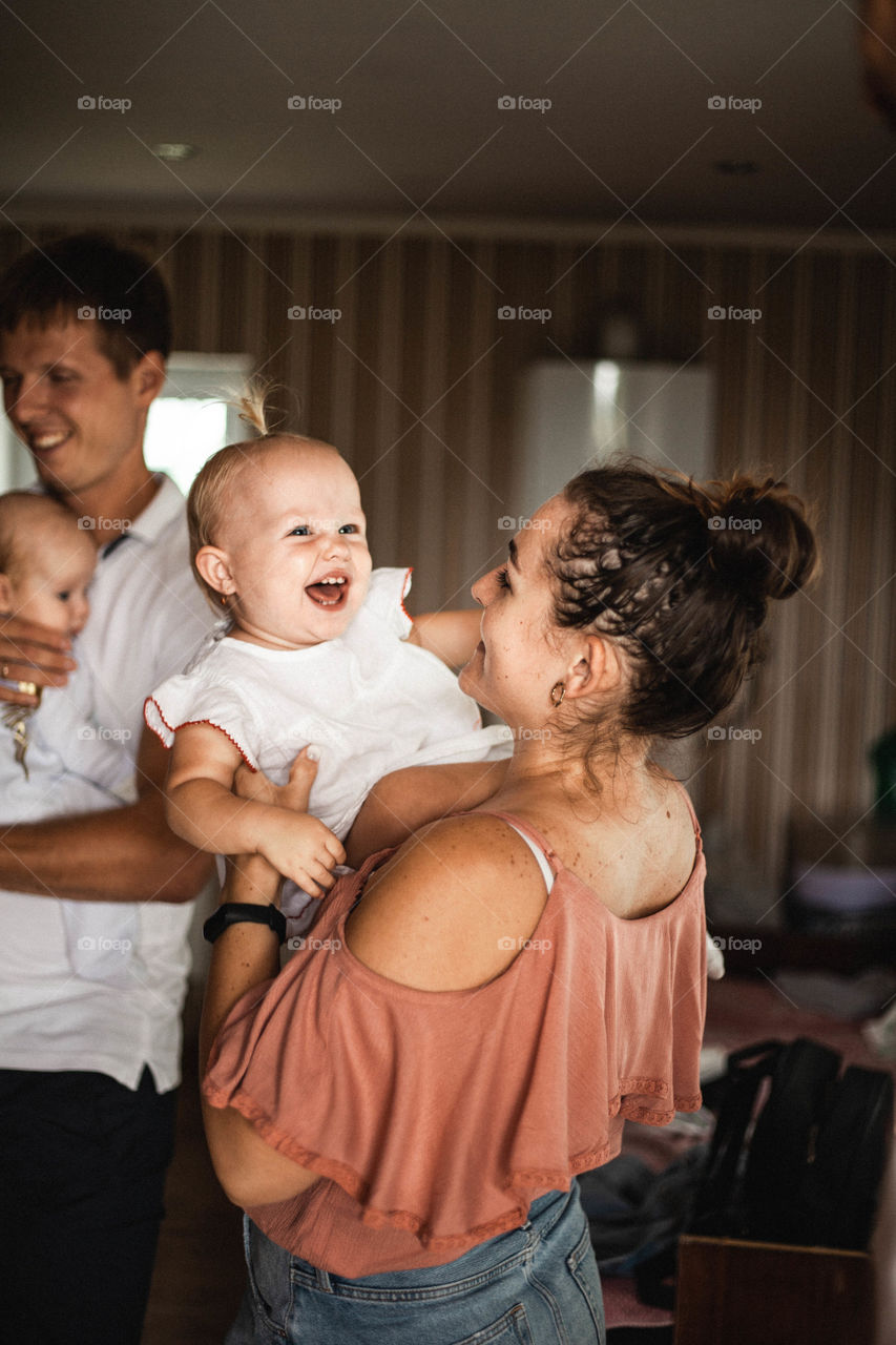 photo of mother and daughter, she plays with the child