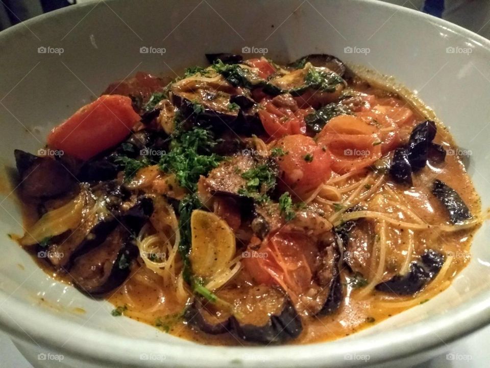 Pasta with smoked mozzarella, tomato, and eggplant