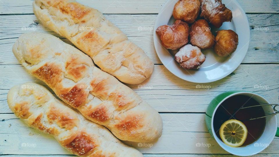 Home baked bread, rolls and cup of tea