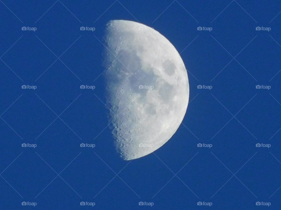 beautiful moon in a nice blue sky.