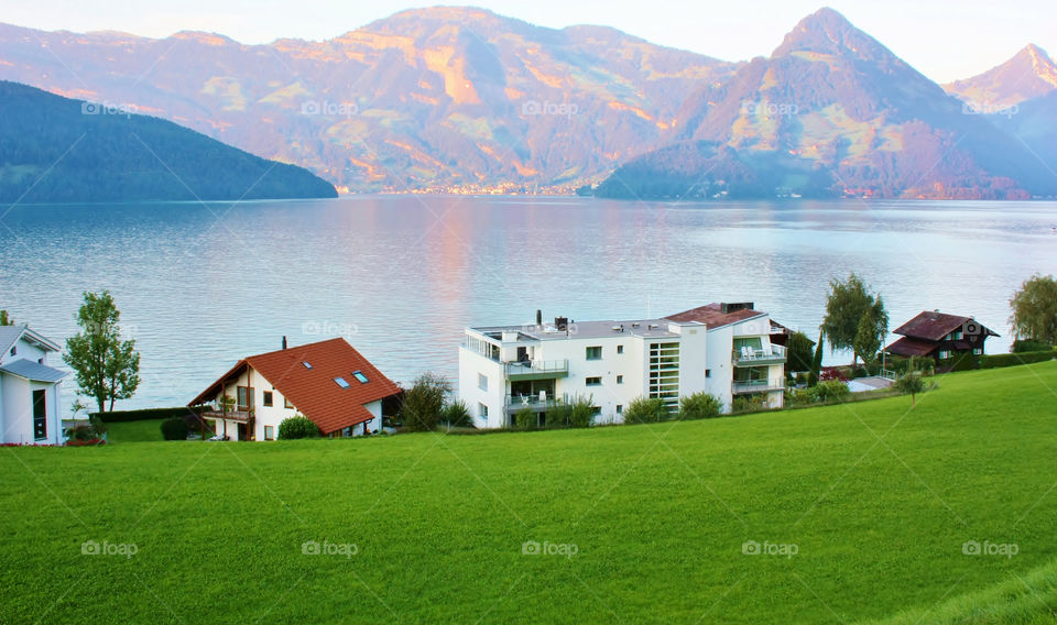 Scenic view of houses by lake