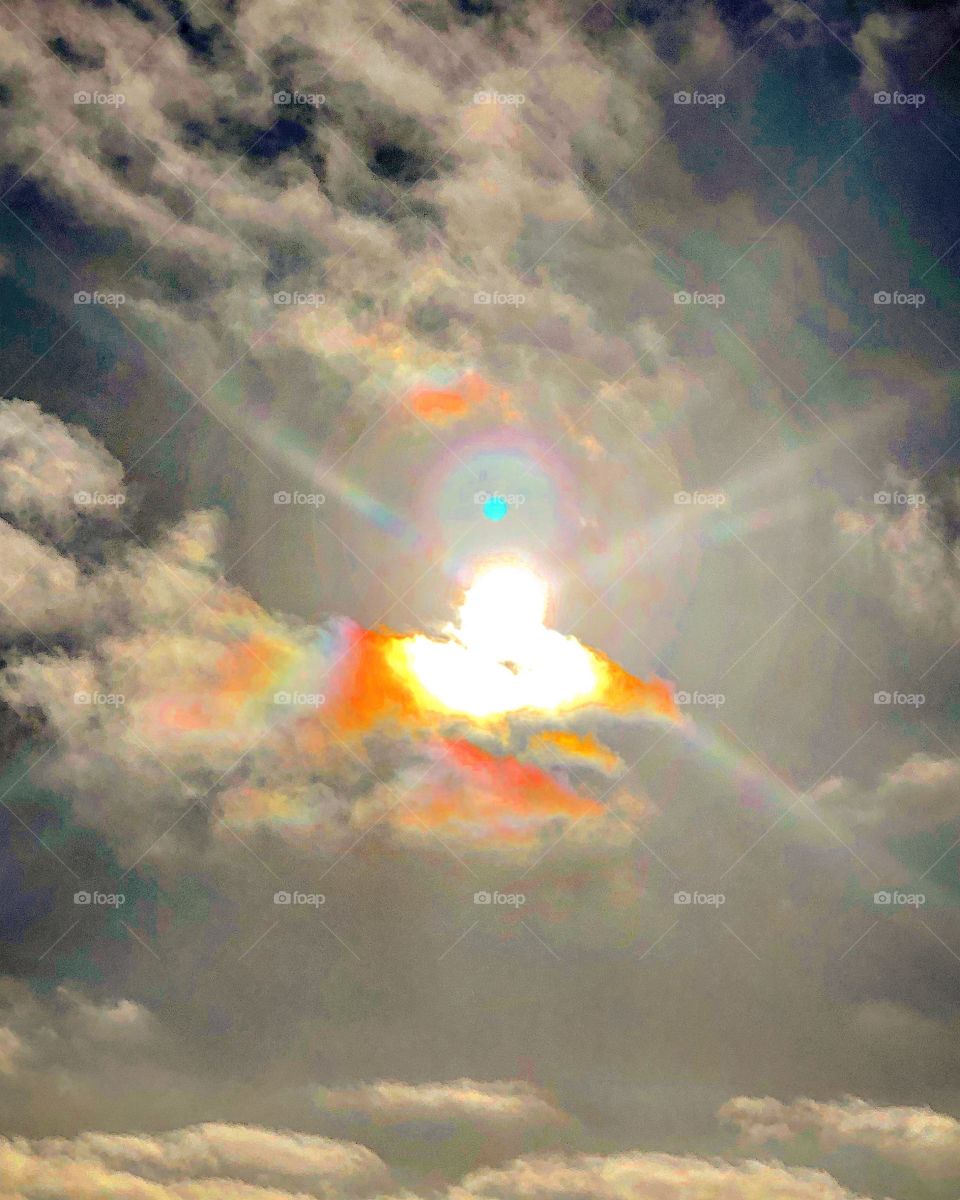 Sun clouds lightship sunbeam rainbow sky beam halo glory 
