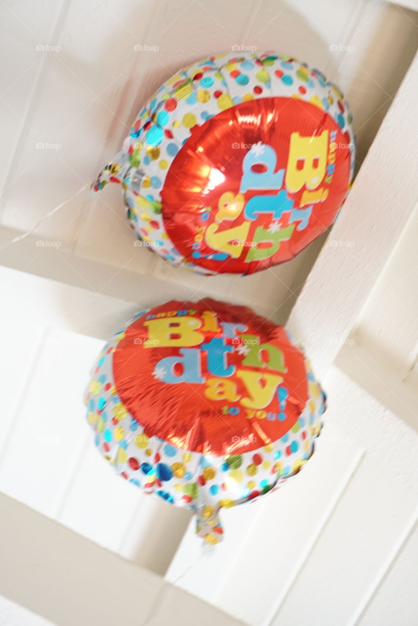 A pair of Happy birthday Balloons