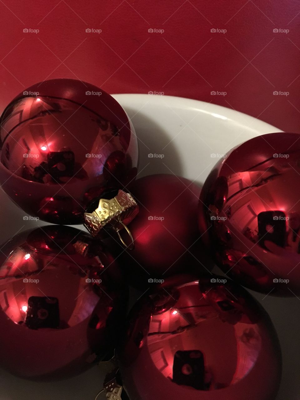 Bowl of red glass Christmas balls