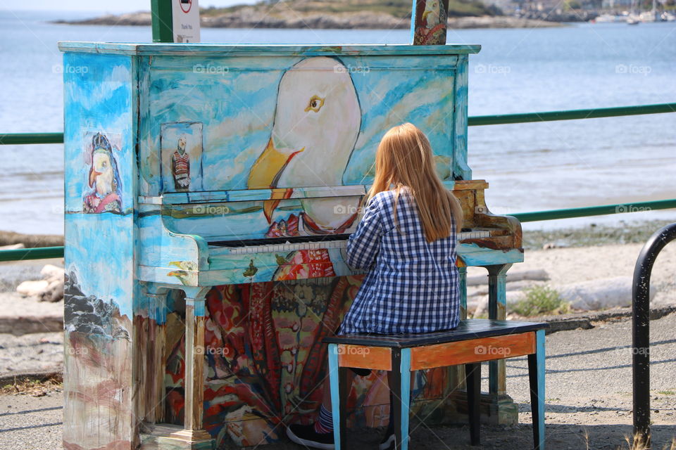 Girl and the colorful piano