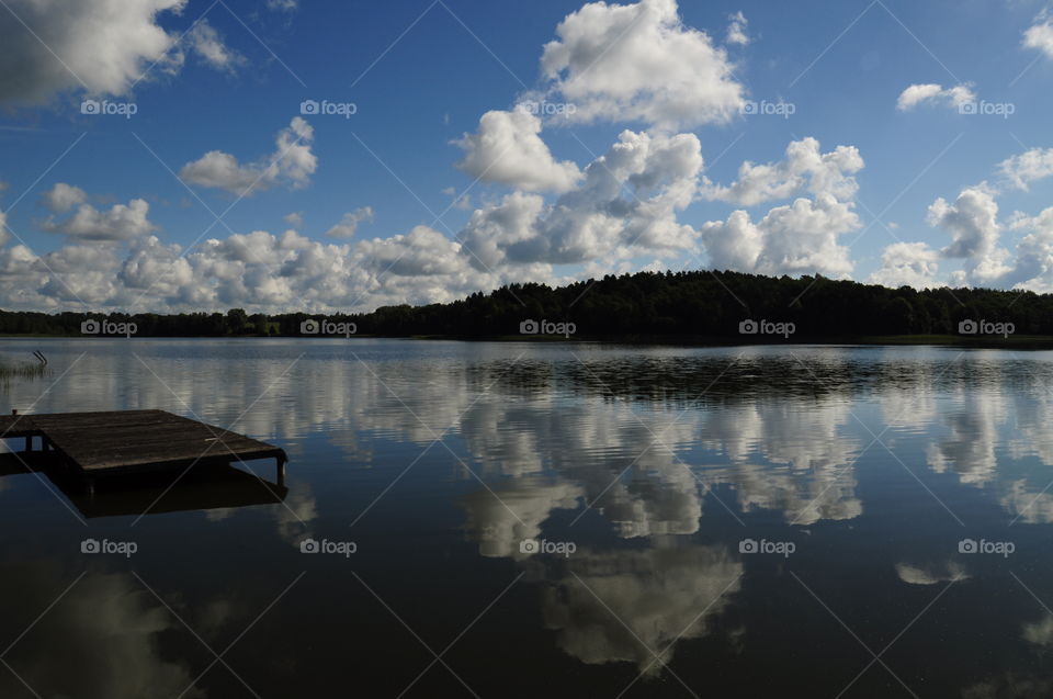 Clouds reflected on river