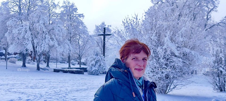 The lovely lady’s face is a bit flushed from the cold here in “Kochel am See”, “Kochel at the Lake”, a small town just north of the “Alps” in “Bavaria”, Germany that is known for its natural hot geyser springs and saunas. 2024. Hypnotic Productions