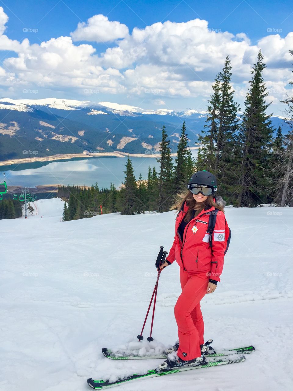 Girl skiing on snowy landscape