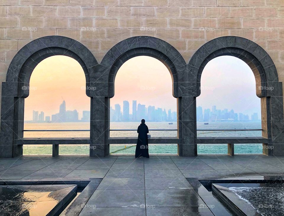 The Museum of Islamic Art in Doha city with a spectacular view to the sunset and the Westbay