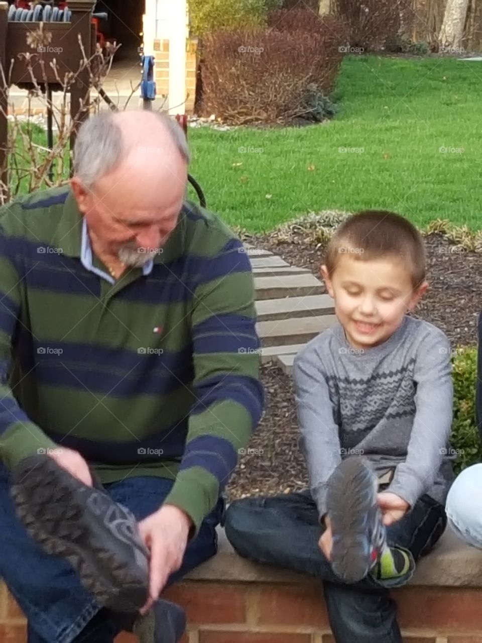 Grandfather and son warring shoes