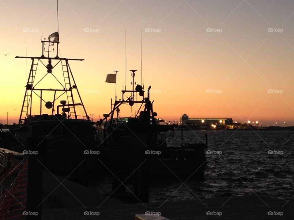 Ships Silhouetted at Dusk 