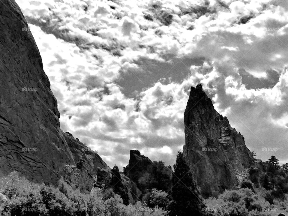 Rock formations at garden of the gods in Colorado Springs on a beautiful summer afternoon. Garden of the gods is the perfect place for a hike, walk, bike, run and they even have rock climbing spots available. Beautiful place to enjoy the outdoors.