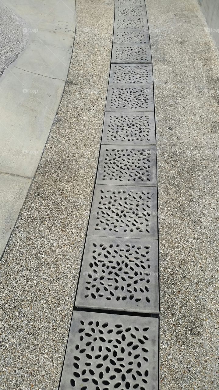 decorative drain covers. beautify the walkway