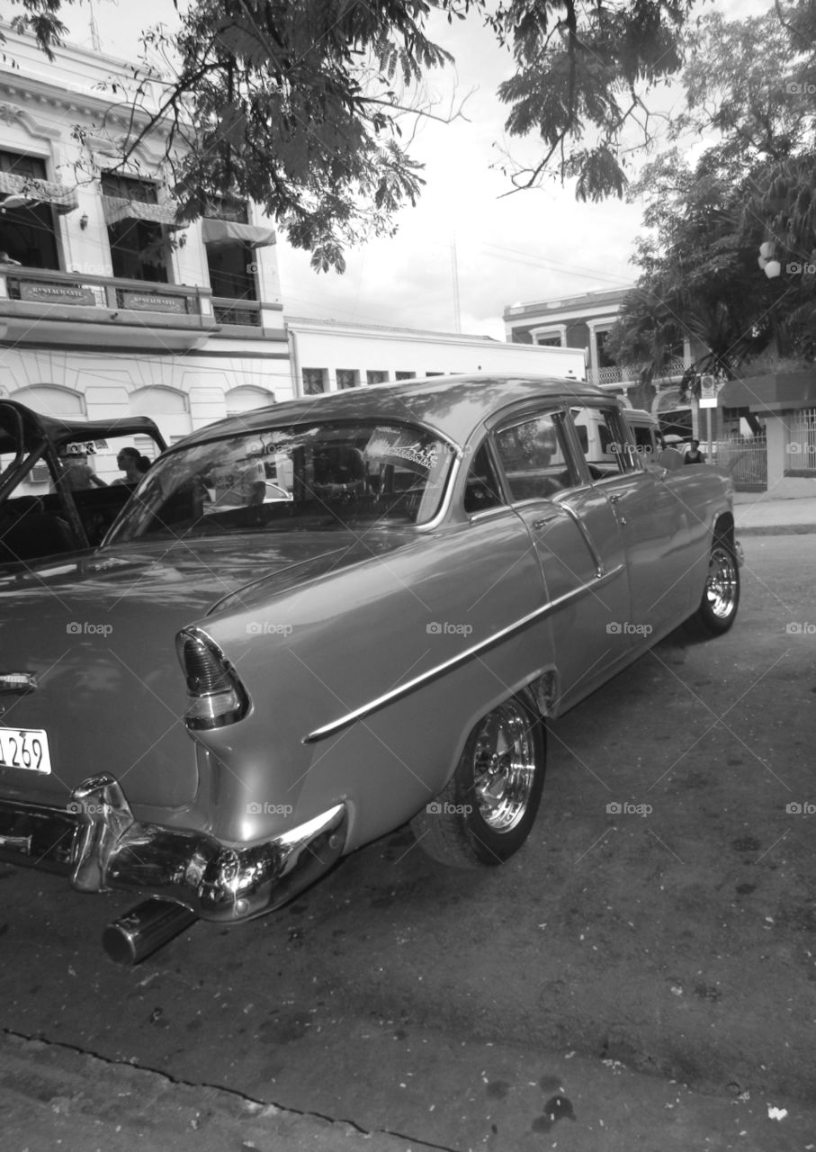 Cuba: Classic Chevy! As I see Santiago de Cuba in black and white, and sometimes in color! Cuba is a special destination and people know how to enjoy themselves, despite obvious signs of poverty and hardships. The streets are filled with vibrant colors and rhythm and it is not uncommon to see people dancing in the streets and alleys to the sound of loud salsa music! Wish I could, but It's impossible to capture it all!